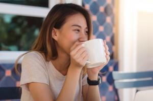 portrait-happy-young-asian-business-woman-with-mug-hands-drinking-coffee-morning_7861-821 2